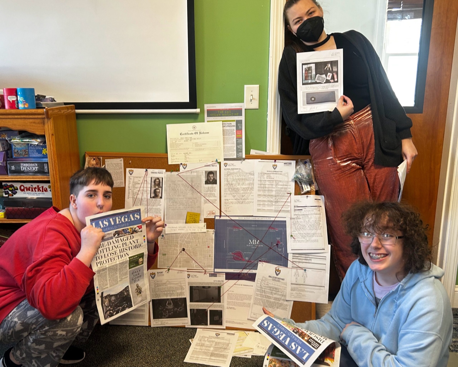 Students examining evidence together in a forensics class